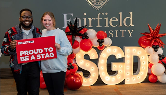 Picture of STAGiving Day sign and students 