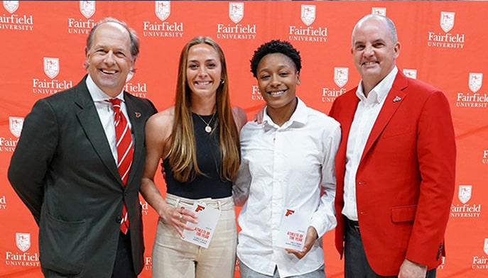 President Mark R. Nemec, PhD, and Vice President for Athletics Paul Schlickmann with the 2023-24 Women's co-Athletes of the Year, Elizabeth Talluto and Janelle Brown