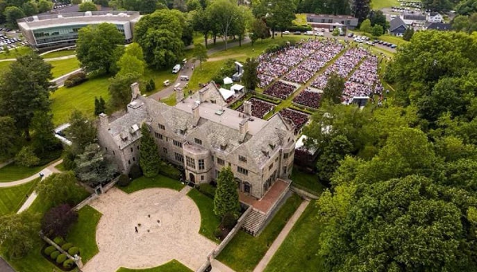 Aerial view of Bellarmine Hall and back lawn during a Commencement ceremony. 