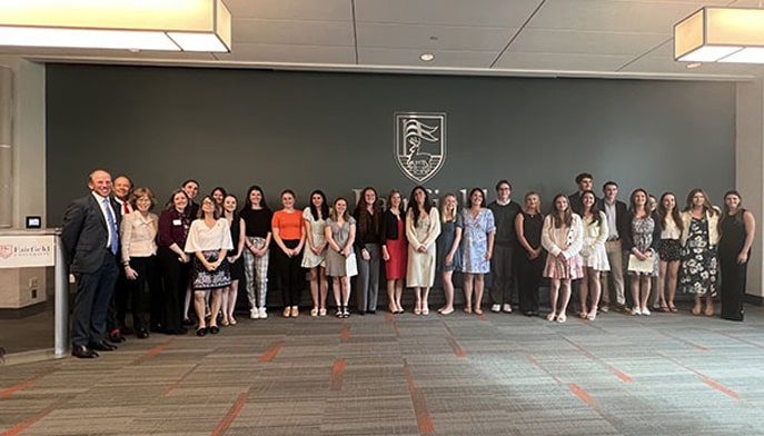 students lined up after getting inducted into national phi beta kappa honor society