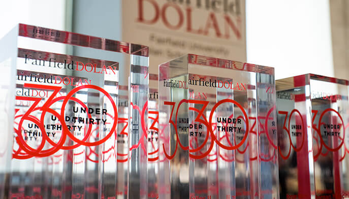 A celebration of the Fairfield Dolan 30 under 30 awards, featuring a table full of transparent awards.