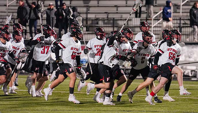 A Fairfield University lacrosse players celebrating.