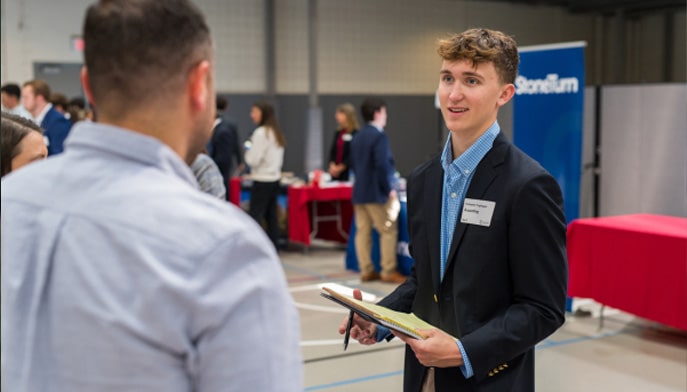 Dolan student networking at a career fair