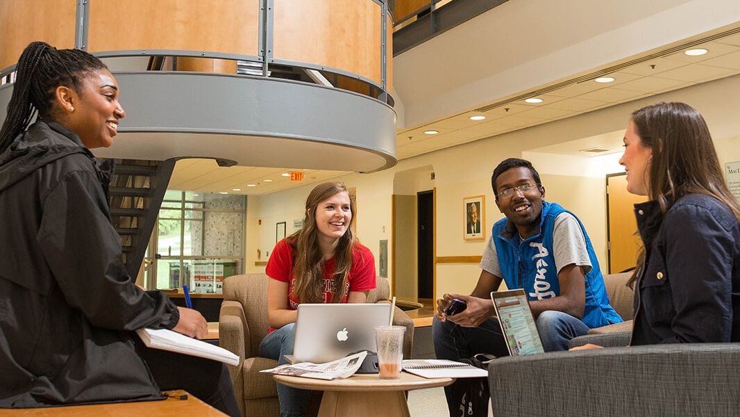 Data Science students sitting around talking. 