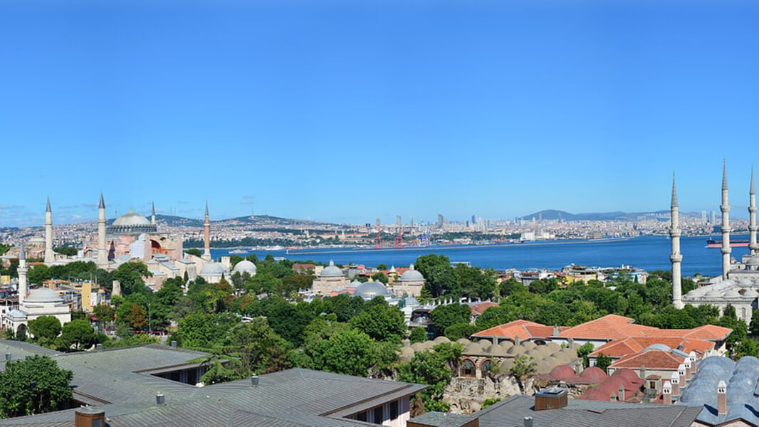 An exterior shot of a body of water with buildings.