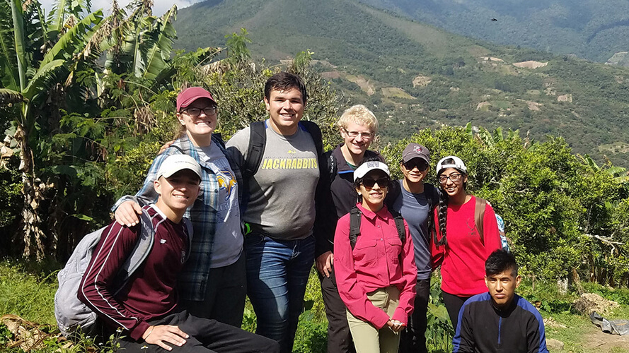 Students posing for a photo in latin America. 