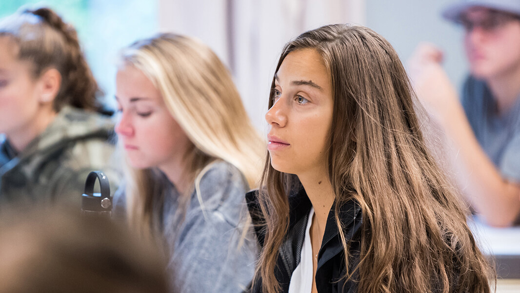 Students sit in a classroom.