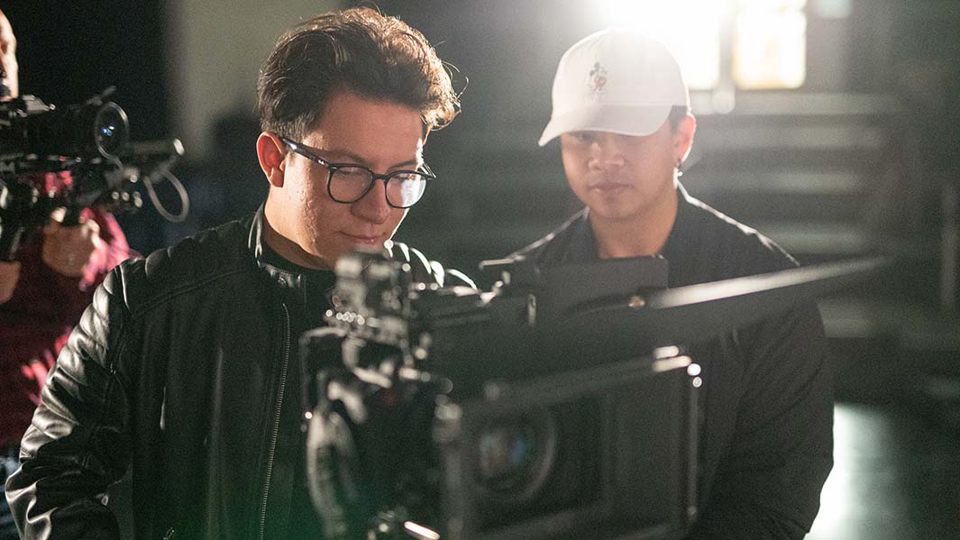 Film students setting up lighting and camera angles during a shooting segment in Fairfield University's Media Center.