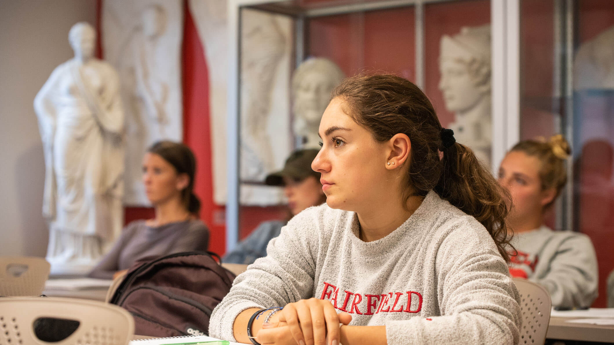 A student sits in a classroom.