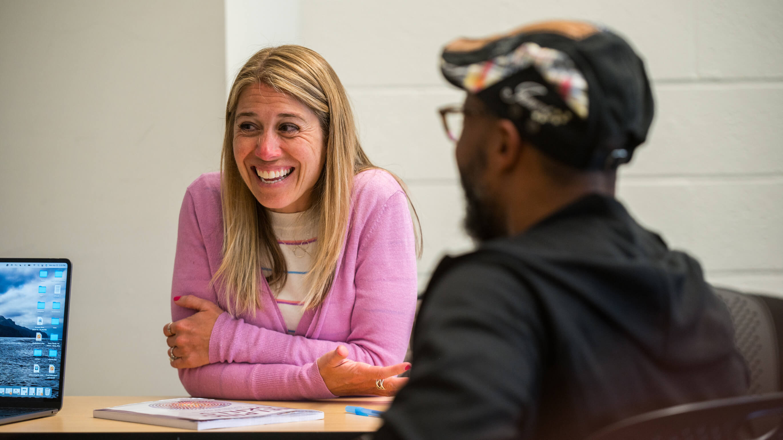 Two students collaborate in a classroom.