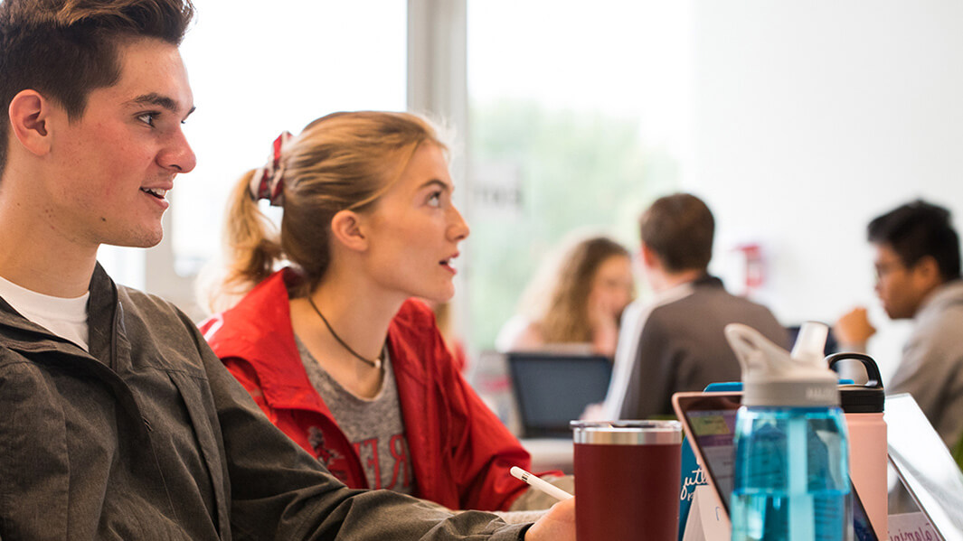 Students paying attention in a classroom. 