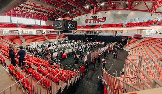 Semi aerial view of the 2024 Student Research Symposium at the Fairfield basketball arena. 