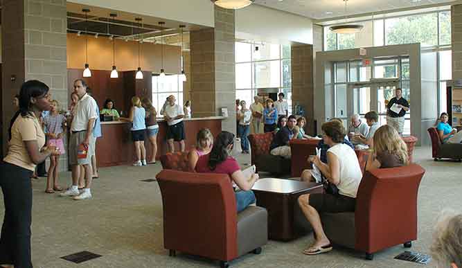 Interior of Kelley Welcome Center with people sitting in chairs.