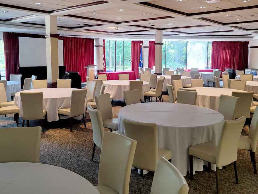 Photo of tables with tablecloths in the Conference Center Dining Room.