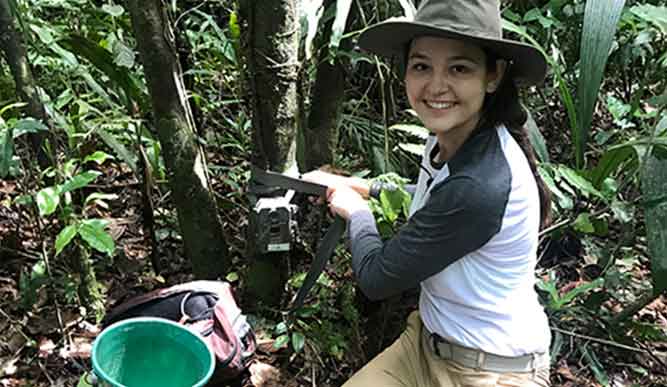 Student working in a garden. 