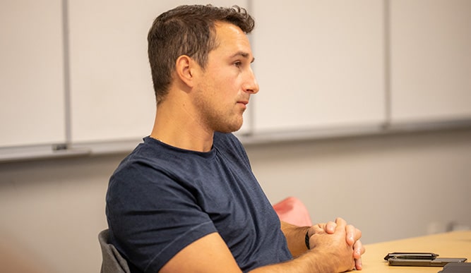 A student sits at a table.