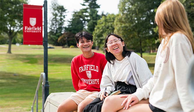 Image of students sitting outside