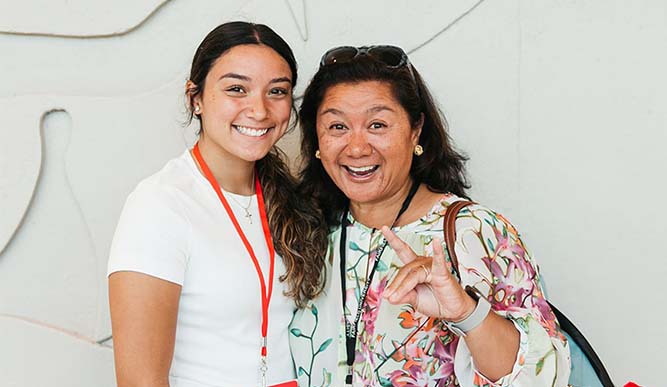 Image of student and her mother posing for picture