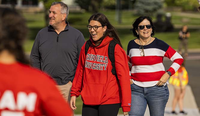 Image of student and parents walking outside