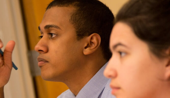 Two students in a classroom.