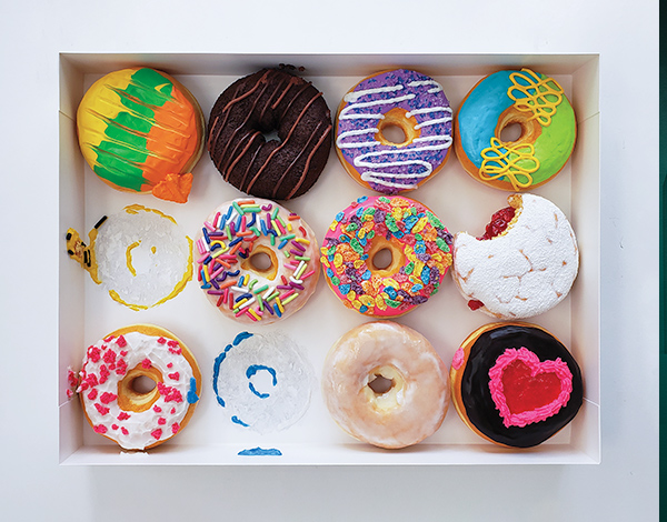 An aerial view of a box of donuts.